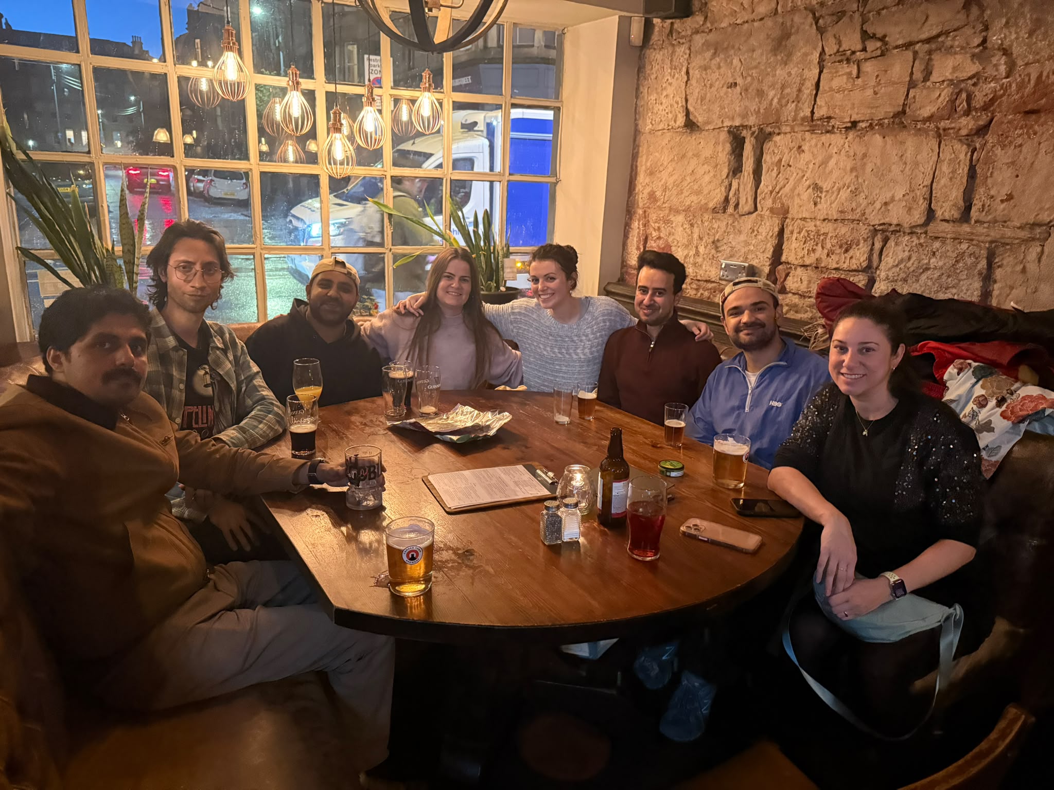 Paula, colleagues, and a few friends gathered around a table in Glasgow